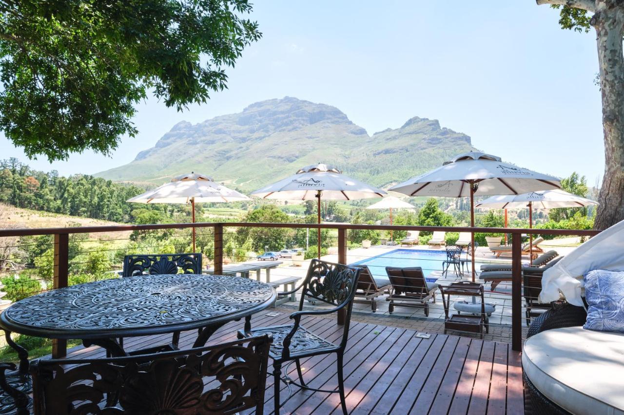 Alluvia Boutique Winery & Luxury Accommodation ستيلينبوش المظهر الخارجي الصورة View of the Three Sisters from the deck of the restaurant at the Boschendal Wine Estate